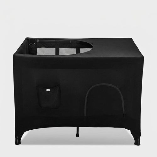 Pack N Play blackout cover stretched over a portable travel crib
